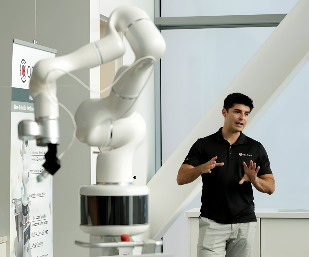 CEO Matthew Sefati stands next to the Cobionix robot.